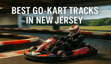 Go-kart racer in helmet driving red, white, and blue kart on racing track